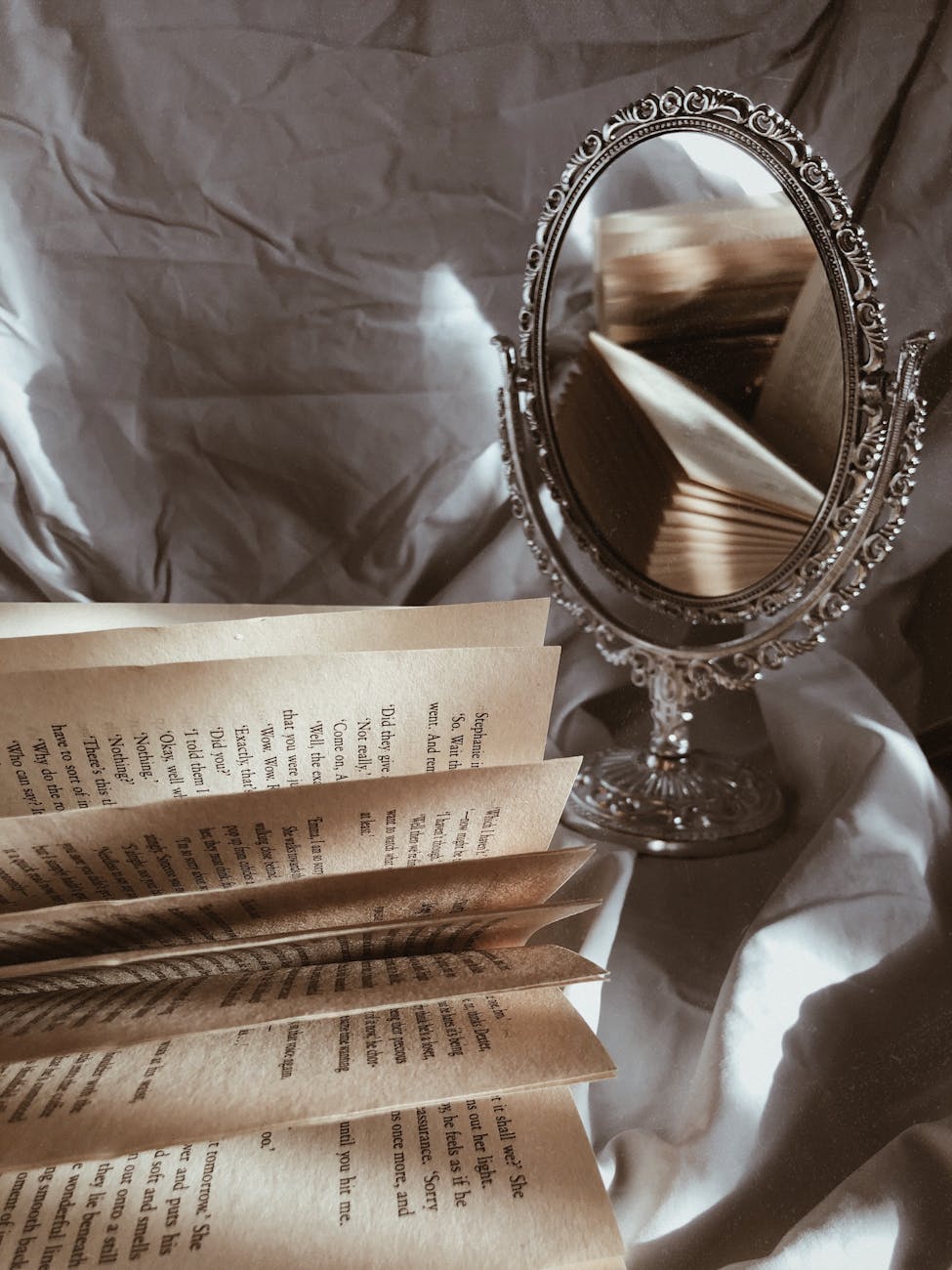close up of a book and a mirror
