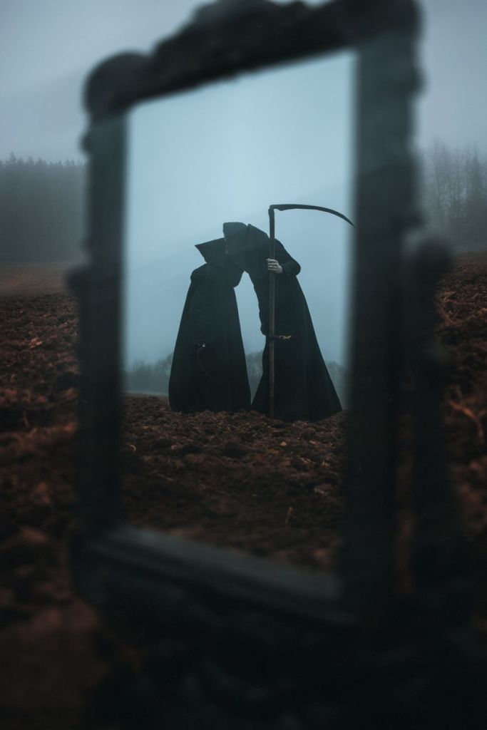 reflection of death like looking figures in a mirror